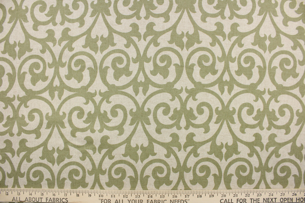 This fabric features a scroll design in olive green on a khaki background. Use this for drapery, pillows, totes, light upholstery, etc. This fabric has a soft workable feel yet is stable and durable. We offer this design in several different colors. 