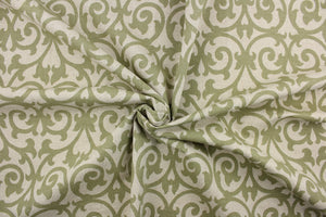 This fabric features a scroll design in olive green on a khaki background. Use this for drapery, pillows, totes, light upholstery, etc. This fabric has a soft workable feel yet is stable and durable. We offer this design in several different colors. 