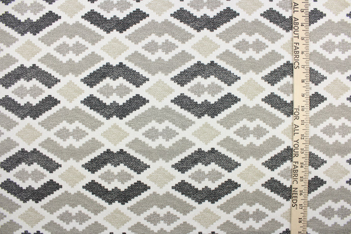 This jacquard fabric features a large scale aztec theme with chenille woven in for luxurious softness.  It can be used for multi purpose upholstery, heavy drapery, pillows, cushions and ottomans.  Colors included are black, white and brown.