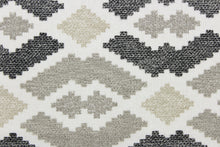 Load image into Gallery viewer, This jacquard fabric features a large scale aztec theme with chenille woven in for luxurious softness.  It can be used for multi purpose upholstery, heavy drapery, pillows, cushions and ottomans.  Colors included are black, white and brown.
