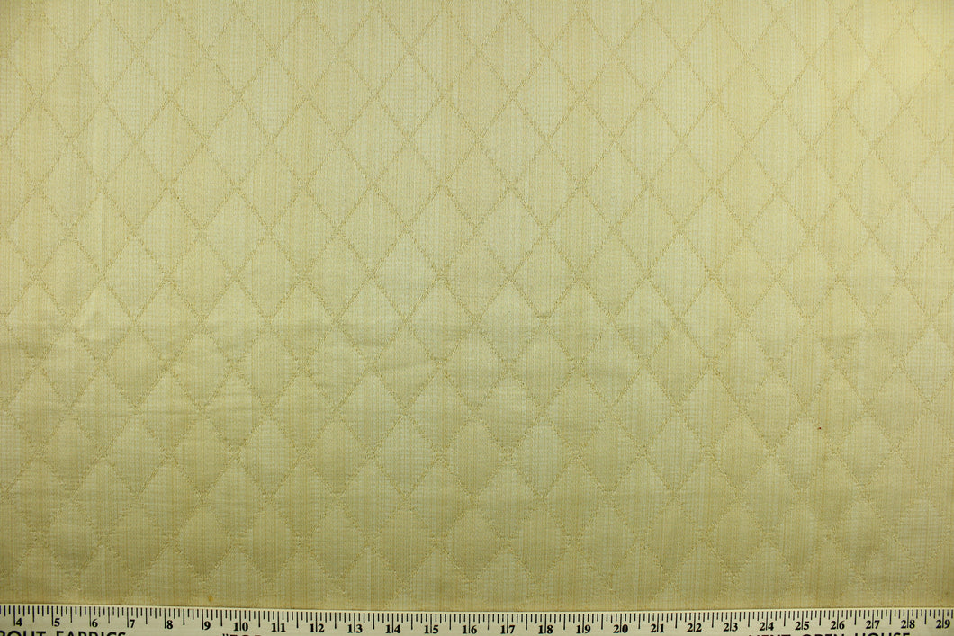 Prismatic is a quilted fabric design in lemon yellow.  It is durable and hard wearing and would be great for multi-purpose upholstery, bedding, accent pillows and drapery.  We offer this fabric in several different colors.