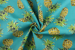  This screen printed fabric features large pineapples on a a teal background and is perfect for outdoor settings and indoors in a sunny room.  It can withstand up to 500 hours of sunlight and is water and stain resistant. Perfect for porches, patios and pool side.  Uses include toss pillows, cushions, upholstery, tote bags and more.  Colors included are yellow, green, black and off white.