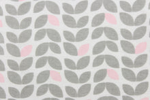 Load image into Gallery viewer, This printed flannel features leaves in gray and pink on a white background.  Uses include apparel,  home decor and crafting.  This fabric has a soft workable feel. 
