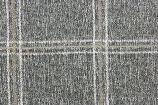 This fabric features a plaid design in gray, white and brown.  It is perfect for outdoor settings or indoors in a sunny room.  It can withstand up to 500 hours of sunlight and is water and stain resistant.  Perfect for porches, patios and pool side.  Uses include toss pillows, cushions, upholstery, tote bags and more. 