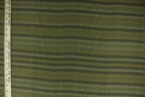  This rich woven yarn dyed fabric features a striped design in shades of green.  Enhancing the color and texture of the stripes is a slight sheen.  Heavy weight and woven stripes make the 100% polyester fabric durable, strong and fade resistant.  This fabric would enrich any room whether you use it for upholstery, throw pillows or home décor.