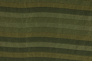  This rich woven yarn dyed fabric features a striped design in shades of green.  Enhancing the color and texture of the stripes is a slight sheen.  Heavy weight and woven stripes make the 100% polyester fabric durable, strong and fade resistant.  This fabric would enrich any room whether you use it for upholstery, throw pillows or home décor.