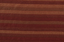 Load image into Gallery viewer, This rich woven yarn dyed fabric features a striped design in shades of red.  Enhancing the color and texture of the stripes is a slight sheen.  Heavy weight and woven stripes make the 100% polyester fabric durable, strong and fade resistant.  This fabric would enrich any room whether you use it for upholstery, throw pillows or home décor.
