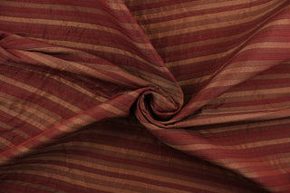 This rich woven yarn dyed fabric features a striped design in shades of red.  Enhancing the color and texture of the stripes is a slight sheen.  Heavy weight and woven stripes make the 100% polyester fabric durable, strong and fade resistant.  This fabric would enrich any room whether you use it for upholstery, throw pillows or home décor.