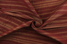 Load image into Gallery viewer, This rich woven yarn dyed fabric features a striped design in shades of red.  Enhancing the color and texture of the stripes is a slight sheen.  Heavy weight and woven stripes make the 100% polyester fabric durable, strong and fade resistant.  This fabric would enrich any room whether you use it for upholstery, throw pillows or home décor.
