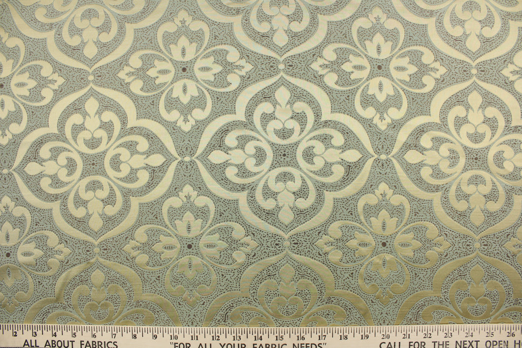 This jacquard fabric features a medallion design in shiny gold on a green background with accents of brown.  It is great for home decor such as multi-purpose upholstery, window treatments, pillows, duvet covers, tote bags and more.  It has a soft workable feel yet is stable and durable.