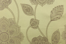 Load image into Gallery viewer, This fabric features a large-scale floral pattern in taupe on a spring green background.  The slight sheen enhances the design.  It would be great for home decor such as multi-purpose upholstery, window treatments, pillows, duvet covers, tote bags and more.  It has a soft workable feel yet is stable and durable.
