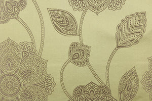 This fabric features a large-scale floral pattern in taupe on a spring green background.  The slight sheen enhances the design.  It would be great for home decor such as multi-purpose upholstery, window treatments, pillows, duvet covers, tote bags and more.  It has a soft workable feel yet is stable and durable.