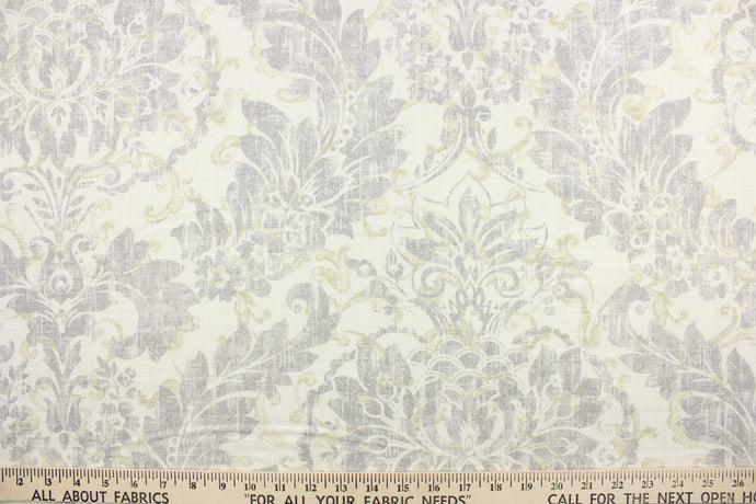 This fabric features a floral and paisley print in gray, greenish brown on a linen colored background.  It is durable with 12,000 double rubs.  It is perfect for window treatments (draperies, valances, curtains, and swags), bed skirts, duvet covers, pillow shams, accent pillows, tote bags.