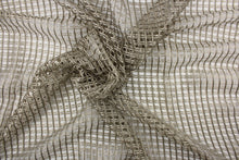 Load image into Gallery viewer, This sheer fabric features a net weave design in a pewter. 
