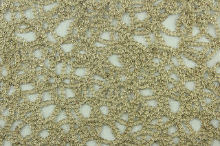 This see through fabric has as firm texture featuring woven mesh lace with metallic gold thread and a scalloped border.  It is perfect for special occasion apparel, costumes, overlays, table tops and decorations.  