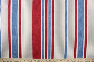This multi use fabric features a heavy striped design in red, blue, gray and white. 