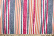 Load image into Gallery viewer, This multi use fabric features a heavy striped design in pink, blue, orange and white.
