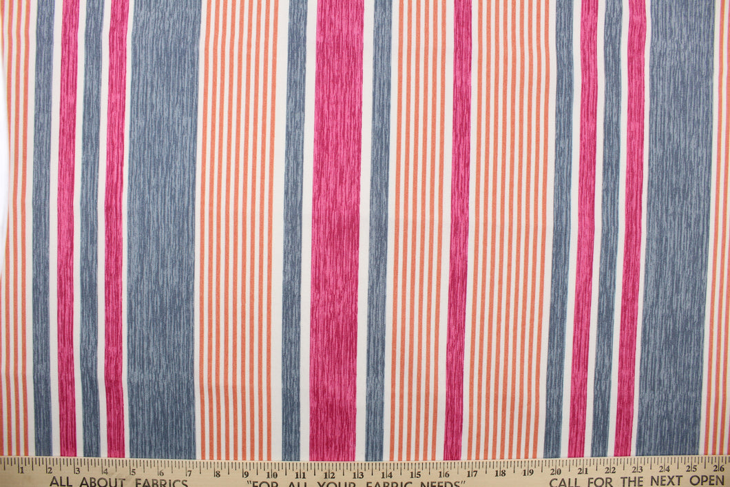 This multi use fabric features a heavy striped design in pink, blue, orange and white.