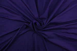  A 8 way stretch jersey lycra in a solid rich purple . 
