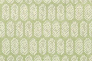 This fabric features a leaf design in white set against a light green. 