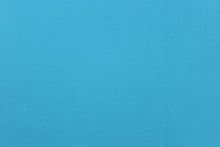 Load image into Gallery viewer, Twill fabric in solid blue. 
