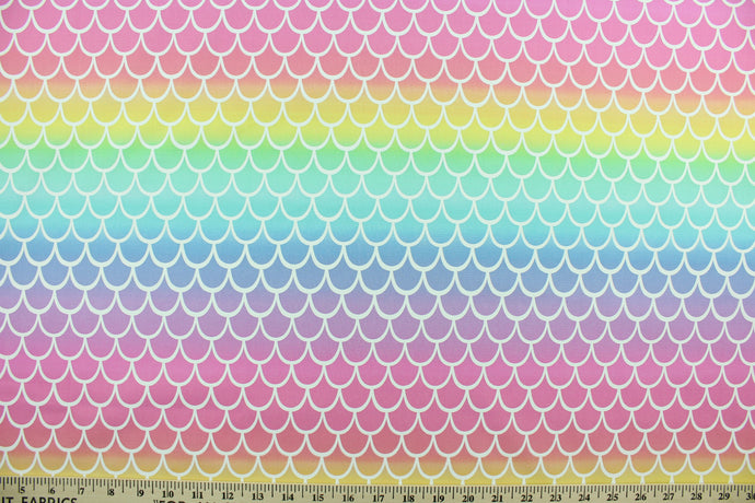 Mermaid Scales is a bright colored pastel print in the colors of pink, purple, blue, green and yellow.  The versatile lightweight fabric is soft and easy to sew.  It would be great for quilting, crafting and sewing projects.  