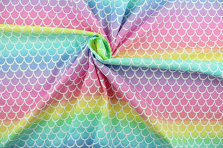 Mermaid Scales is a bright colored pastel print in the colors of pink, purple, blue, green and yellow.  The versatile lightweight fabric is soft and easy to sew.  It would be great for quilting, crafting and sewing projects.  