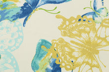 Load image into Gallery viewer, This fabric features a butterfly design in golden yellow, light turquoise blue, green, and blue set against a white background . 
