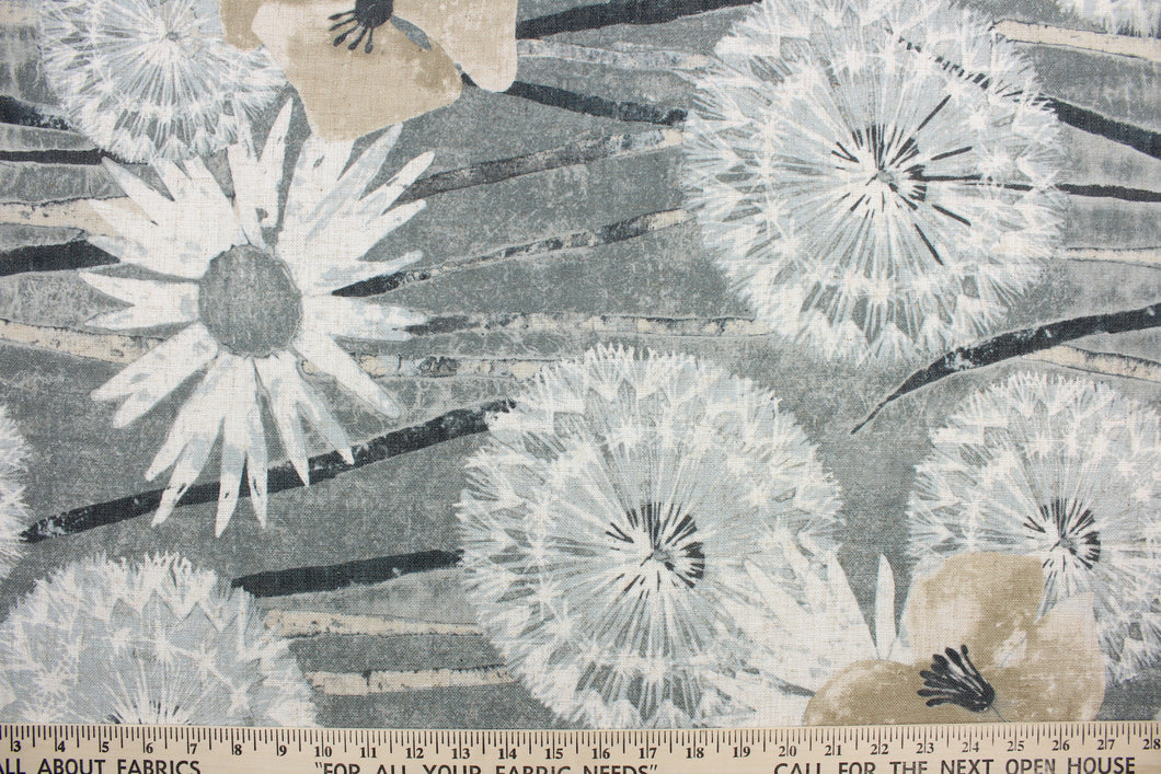 This fabric features a floral design in  gray, beige, black, and white.
