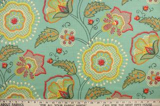 This fabric features a floral design in  green, orange, cream, dark pink, yellow and dark gray against a blue green.