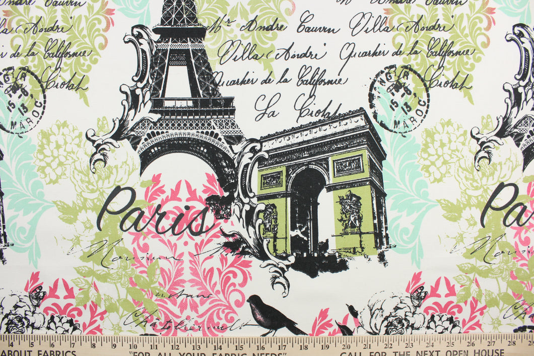 This fabric features a Paris design in black, white, pink, light turquoise and green .