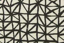 Load image into Gallery viewer, This fabric features a geometric design in black against a white background. 
