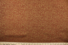 Load image into Gallery viewer, This fabric features an abstract design in a rich red and brown  with a latex backing. 
