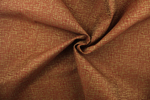 This fabric features an abstract design in a rich red and brown  with a latex backing. 