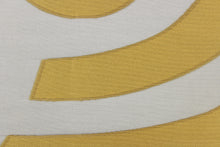 Load image into Gallery viewer, This sheer fabric features a curved line design  in a gold and black . 
