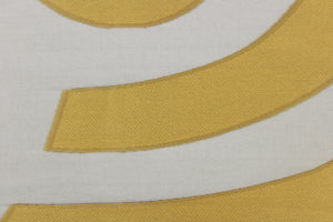 This sheer fabric features a curved line design  in a gold and black . 