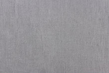 Load image into Gallery viewer, A sheer fabric in a shimmering gray .
