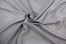 Load image into Gallery viewer, A sheer fabric in a shimmering gray .

