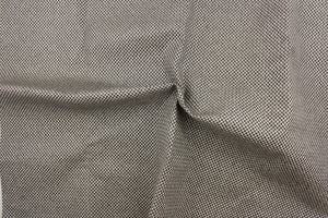 This vinyl fabric features a weave design in black and gray .