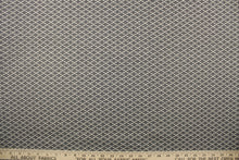Load image into Gallery viewer, This fabric features a oval design in a cream, and shades of gray  with a latex backing.
