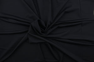 An 8 way lycra  fabric in a solid black 
