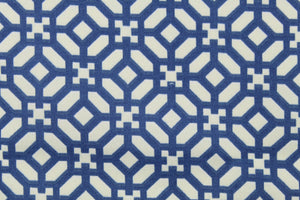 This outdoor fabric features a geometric design in blue and white .