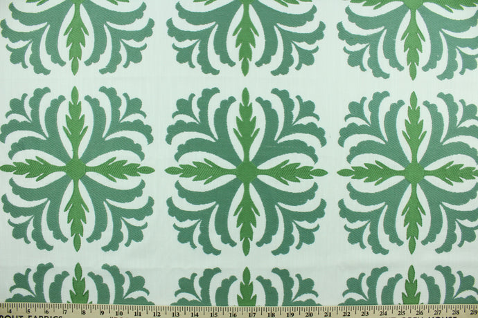 Joleen features a large leaf design in green on a white background.  Uses include drapery, pillows, light upholstery, table runners, bedding, headboards and home décor.