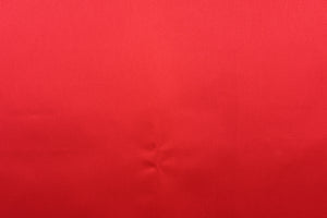  A beautiful satin fabric in a red color . 