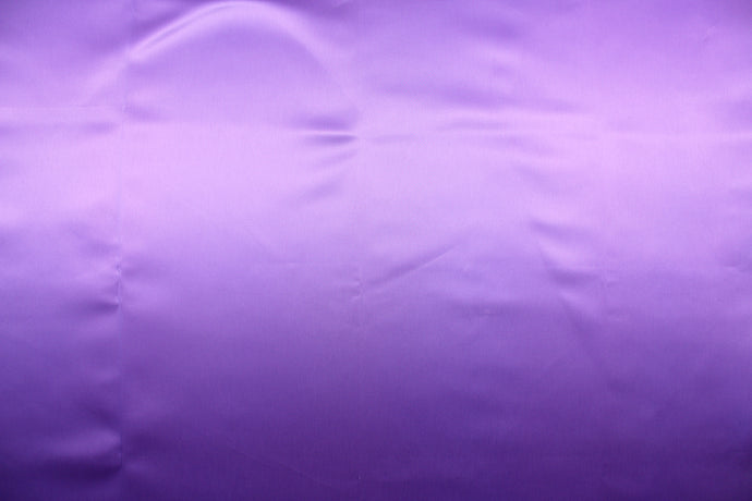 A beautiful satin fabric in a color purple. 