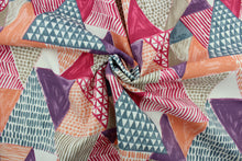 Load image into Gallery viewer, This multi use fabric features a geometrical design in orange, pink, taupe, blue, purple and white.  It is perfect for outdoor settings or indoors in a sunny room.  It is stain and water resistant and can withstand up to 500 hours of direct sun exposure and has a durability rating of 10,000 double rubs.  Uses include decorative pillows, cushions, chair pads, tote bags and upholstery.
