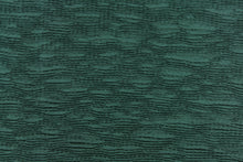 Load image into Gallery viewer, This taffeta fabric features a crinkle in a rich green .
