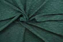 Load image into Gallery viewer, This taffeta fabric features a crinkle in a rich green .
