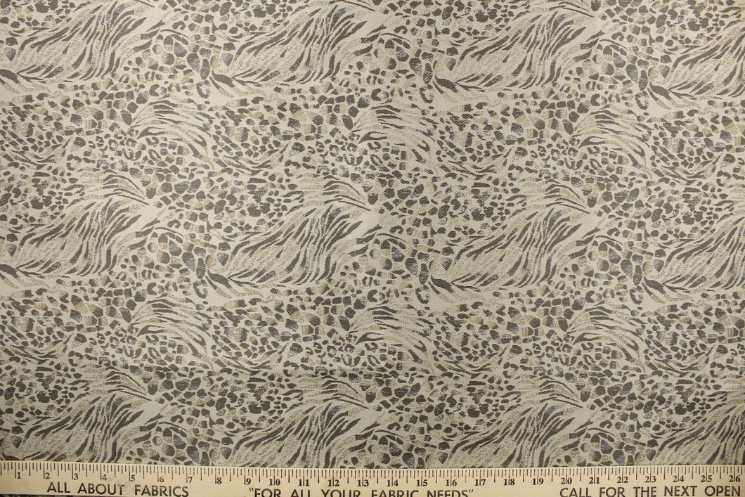 This fabric features a unique design in shades of gray, taupe, and beige with a latex backing.