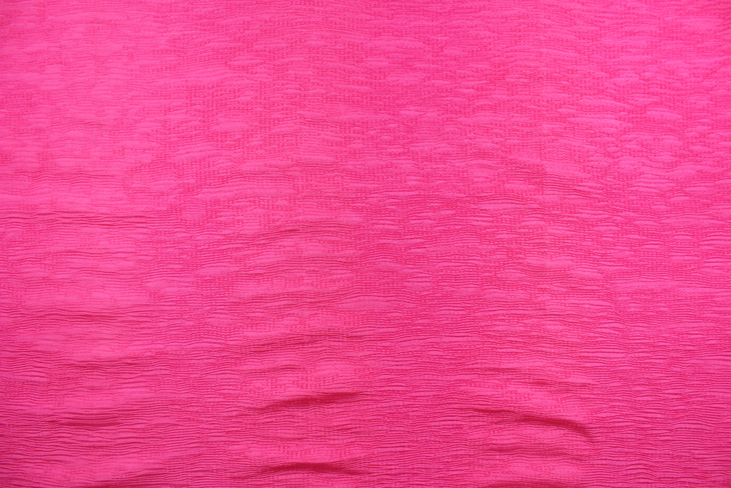 This taffeta fabric features a crinkle design in a hot pink.